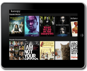 Kanopy streaming platform interface showing a selection of popular movies and documentaries available through the library.