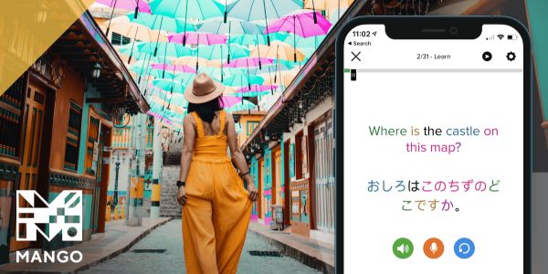 Mango Languages promotional graphic showing a woman walking down a colorful street with umbrellas overhead next to a smartphone screen displaying a language lesson that asks Where is the castle on this map in English and Japanese with the Mango logo in the corner